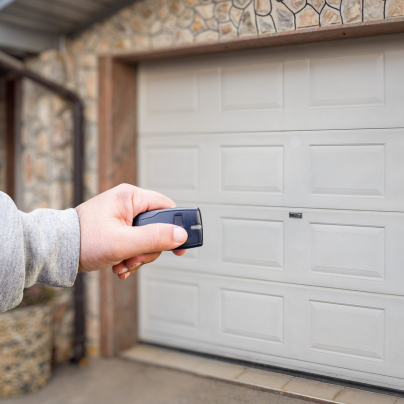Memphis security key fob pointing to a garage door